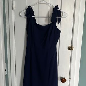 Deep blue midi dress with tie straps.